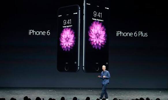 Apple CEO Tim Cook introduces the new iPhone 6 and iPhone 6 Plus on Tuesday, Sept. 9, 2014.