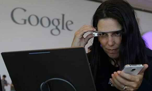 Cecilia Abadie, founder of 33 Labs, uses a pair of Google Glass as she registers for Google I/O 2014.