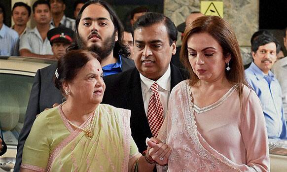 Industrialist Mukesh Ambani with his mother Kokilaben(L) and wife Nita Ambani arrives at the 40th annual general meeting of Reliance Industries in Mumbai.