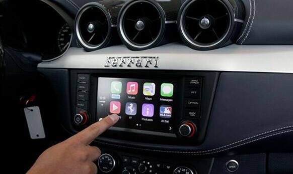 Stephen Chick with Apple gives a demonstration of CarPlay in a Ferrari at the Apple Worldwide Developers Conference.