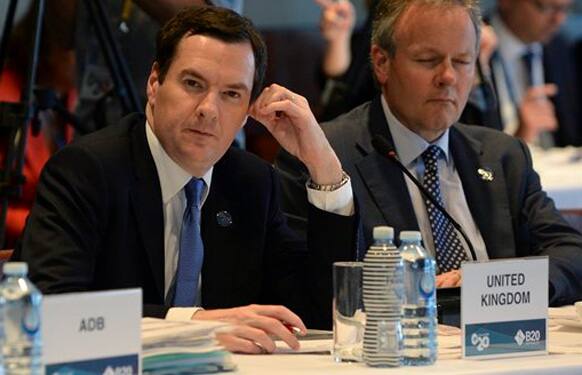 Britain's Treasury chief George Osborne, left, looks on during the Joint G20 and B20 Infrastructure Roundtable, as part of the G20 Finance Ministers and Central Bank Governors meeting in Sydney, Australia, Friday, Feb. 21, 2014. 