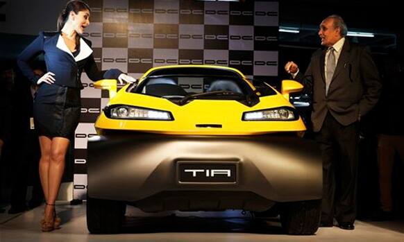 Indian actor Kareena Kapoor, left, poses with Dilip Chabria during the launch of Tia, a car designed by Chabria, at the 12th Indian auto Expo in Noida, India, Wednesday, Feb. 5, 2014. 