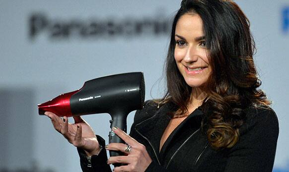 Panasonic shows the new EH-NA65 hair dryer during the Panasonic news conference at the 2014 International Consumer Electronics Show.