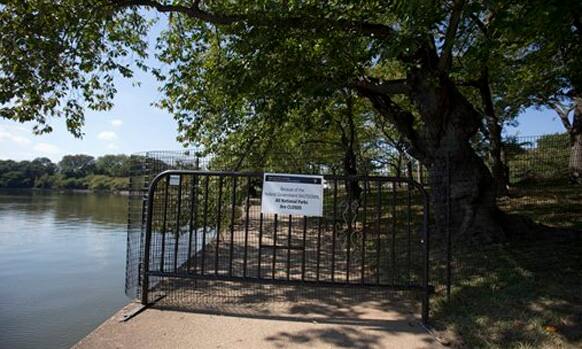 A barrier blocks the path along the Tidal Basin in Washington, Tuesday, Oct. 1, 2013, that leads to the Martin Luther King, Jr. Memorial which is closed.