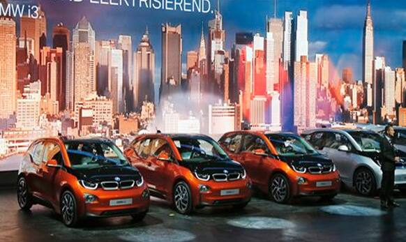 BMW development head Herbert Diess presents the new BMW i3 electric car during the first press day of the 65th Frankfurt Auto Show in Frankfurt.