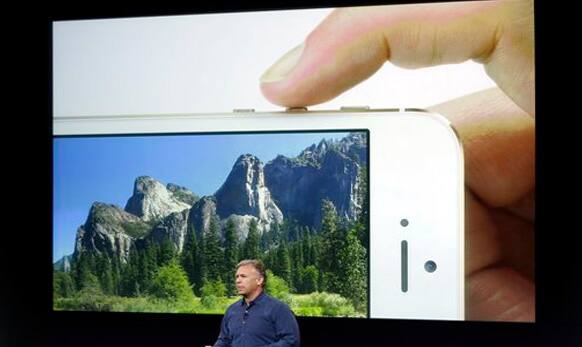 Phil Schiller speaks on stage about the camera quality during the introduction of the new iPhone 5s.