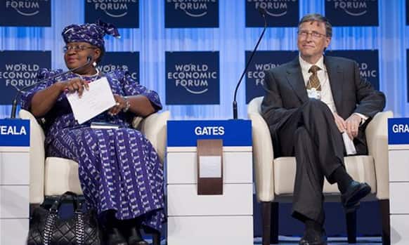 Bill Gates, co-chairman of the Bill & Melinda Gates Foundation, right, and Ngozi Okonjo-Iweala, coordinating minister for economy and minister of finance of Nigeria, left, attend a plenary session at the 42nd annual meeting of the World Economic Forum.