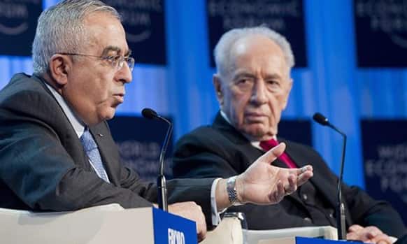 Salam Fayyad, Prime Minister of the Palestinian Authority, left, speaks next to Shimon Peres, President of Israel, right, during a plenary session at the 42nd Annual Meeting of the World Economic Forum.