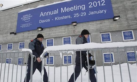 Swiss police officers pass by the Congress Center the day before the opening of the 42nd Annual Meeting of the World Economic Forum, WEF, in Davos, Switzerland.
