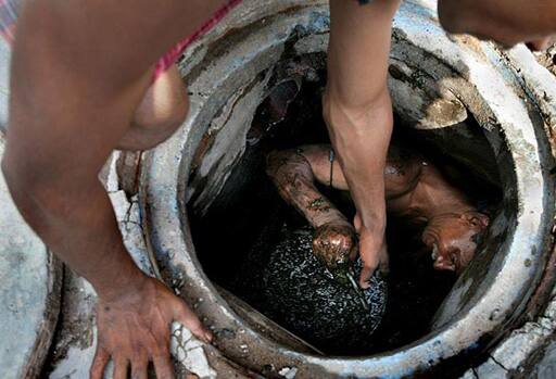 No mint in this hole: Sanitation workers of Kolkata Municipality cleaning out the city’s sewers. Despite a rise in the number of deaths of manhole workers every year, workers regularly go into the manholes without any protective gear.