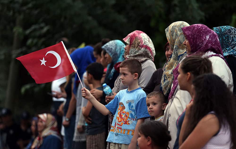 People march to protest against terrorism during the funeral of Turkish army officer Tolga Artug in his hometown of Turgutlu, Manisa, Turkey.