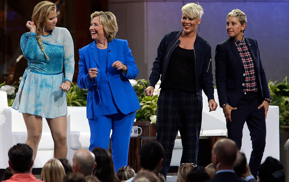 Actress Amy Schumer, left, Democratic presidential candidate Hillary Rodham Clinton, second from left, Ellen DeGeneres and musician Pink dance on stage during a taping of The Ellen DeGeneres Show at Rockefeller Center in New York.