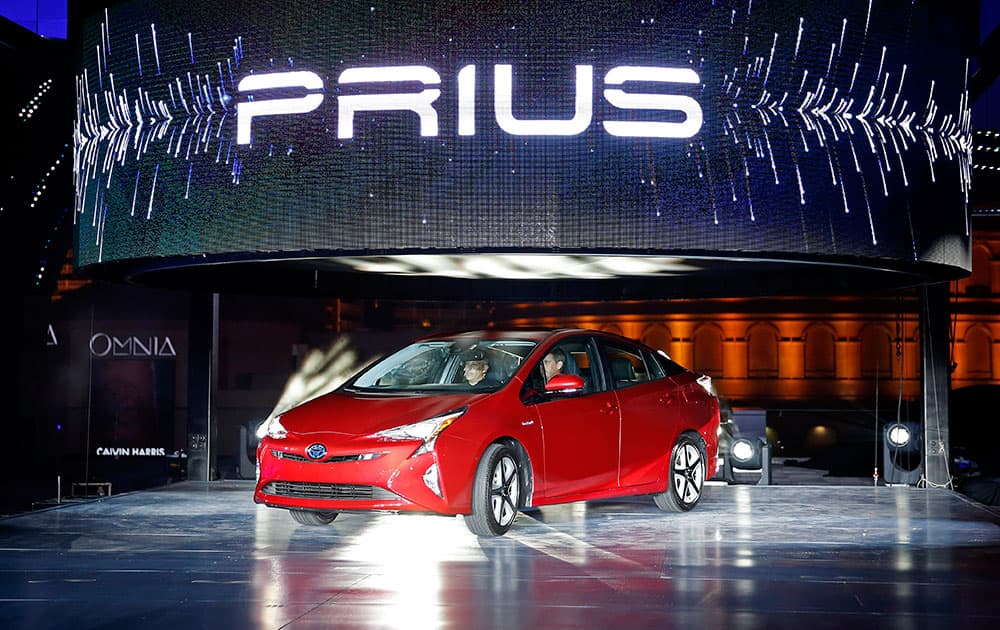 Toyota unveils the latest version of the Prius at an event, in Las Vegas. The car is still the No. 1 hybrid on the market but has been a tougher sell for dealers with gas prices below $3 in many areas of the country.