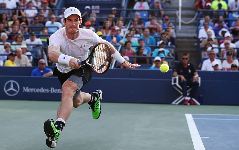 Andy Murray, of the United Kingdom, returns a shot to Kevin Anderson, of South Africa, during the fourth round of the US Open tennis tournament.