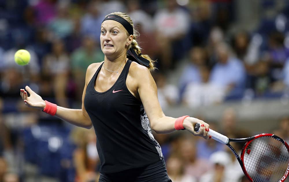 Petra Kvitova, of the Czech Republic, returns the ball to Johanna Konta, of Britain, during their fourth-round match at the US Open tennis tournament in New York.