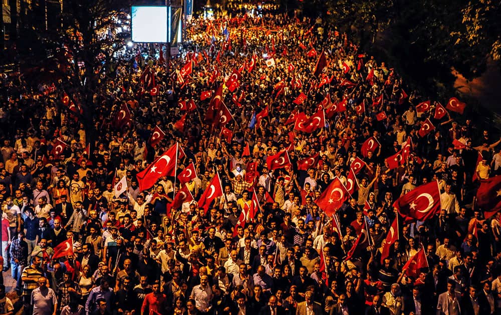 Thousands of people march to protest against the deadly attacks on Turkish troops, in Istanbul, Turkey.