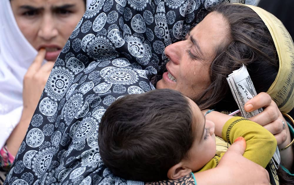 family members of Shafqat Hussain, who was convicted and hanged for killing a boy, mourn his death in Muzaffarabad, Pakistan. 