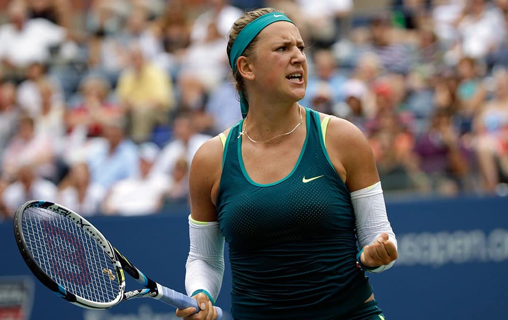 Victoria Azarenka, of Belarus, reacts after a point against Simona Halep, of Romania, during a quarterfinal match at the US Open tennis tournament.