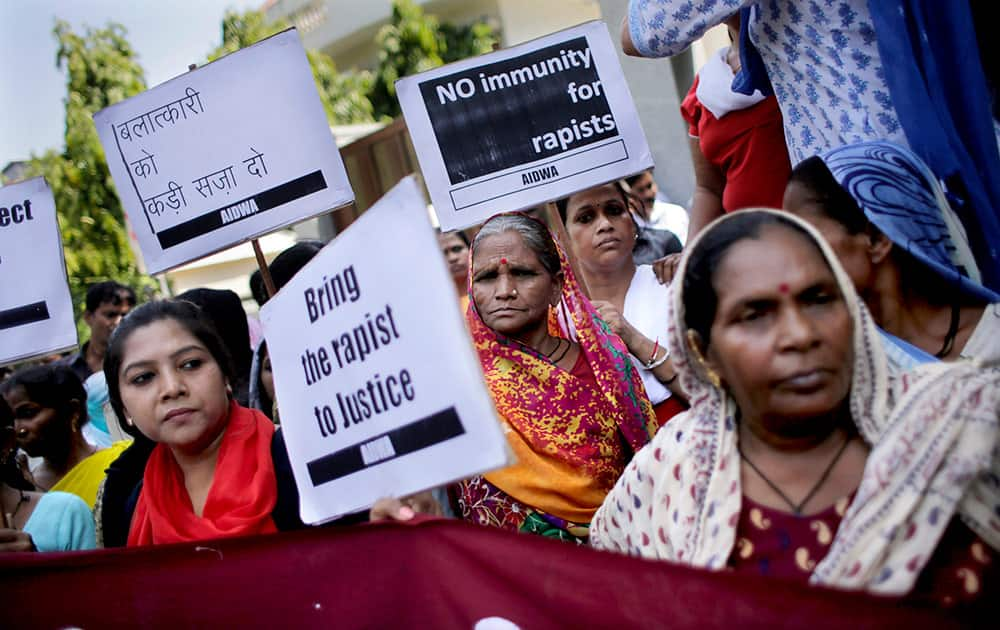 Activists of All India Democratic Women's Association hold placards during a protest outside the Saudi Arabian embassy in New Delhi.