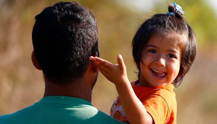 `Europe!` shout refugees as they kiss sand landing on Greek beach