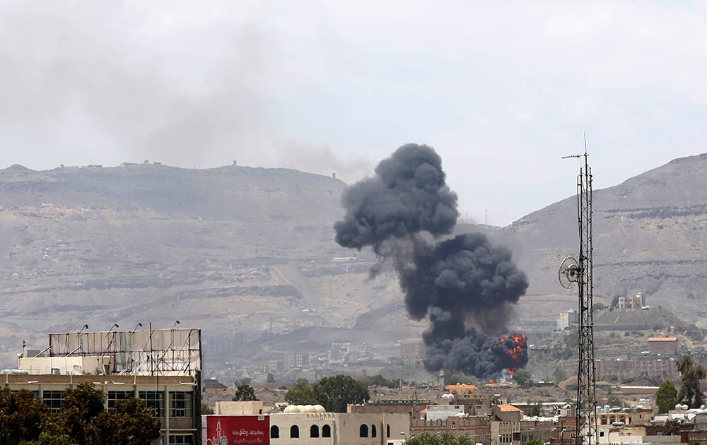 Smoke rises after an airstrike by the Saudi-led coalition at an army base in Sanaa, Yemen.