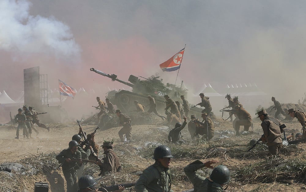 South Korean and US Army soldiers perform a fighting between United Nations forces and North Korean army soldiers during Naktong River Battle re-enactment in Waegwan, South Korea.