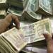 Rupee down 9 paise at 61.9 against US dollar 