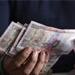 Rupee gains 7 paise at 62.15 against US dollar