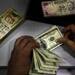 Rupee hits two-month low, down 21 paise to 62.76