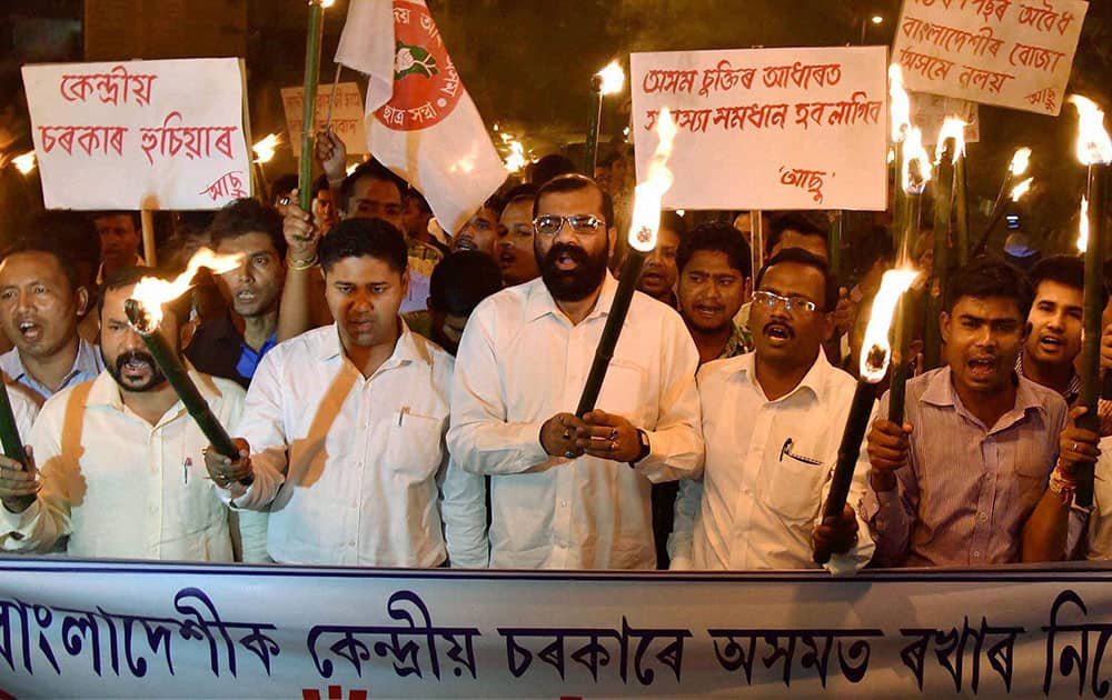 Activists of the All Assam Students Association (AASU) taking out a torch light procession in Guwahati on Thursday in protest against the central government decision to regularize the entry and stay of Hindu Bengalis who migrated from Bangladesh to India.