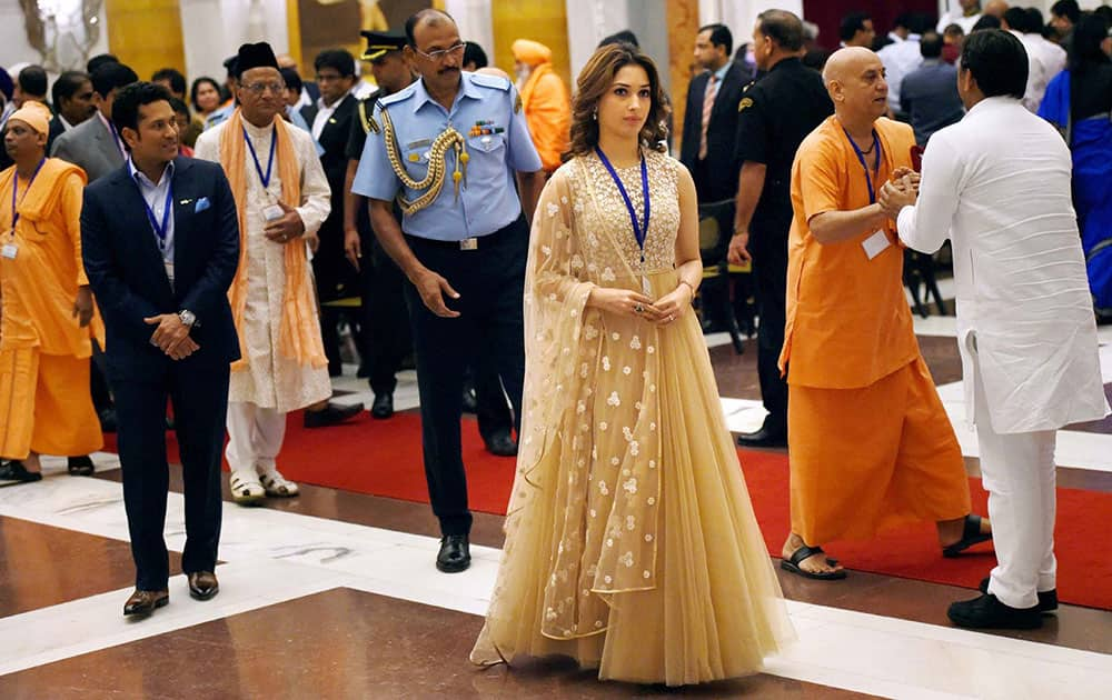 Cricket legend Sachin Tendukar and actress Tamanna at a tea party hosted for the brand ambassador of Swachh Bharat Mission at Rashtrapati Bhavan in New Delhi.