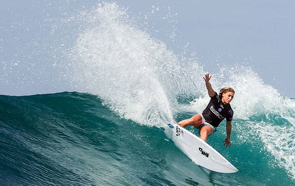 This image provided by the World Surf League, Dimity Stoyle, of Australia, rides a wave in a Round 2 heat at the Swatch Women's Pro surfing meet, in San Clemente, Calif.