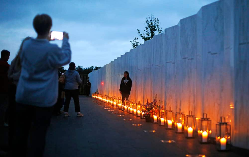 Candles in memory of the passengers and crew of Flight 93, line the Wall of Names at the Flight 93 National Memorial in Shanksville, Pa.