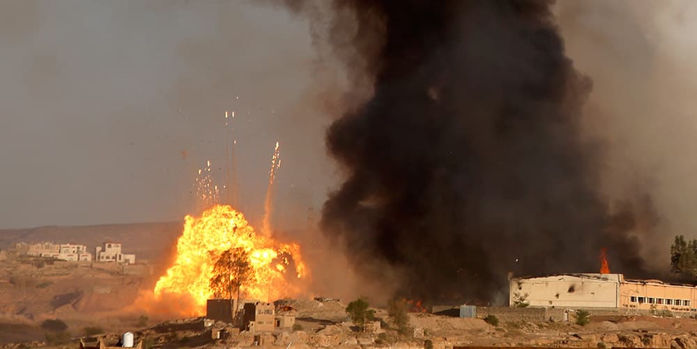 An explosion and smoke rise after an airstrike by the Saudi-led coalition at a weapons depot in Sanaa, Yemen. Saudi Arabia is leading a coalition of mainly Gulf nations fighting the Houthis, who seized the capital, Sanaa.