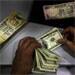 Rupee ends 10 paise up at 63.51 against dollar