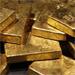 Gold clings above four-month low on euro, but eyes third weekly drop