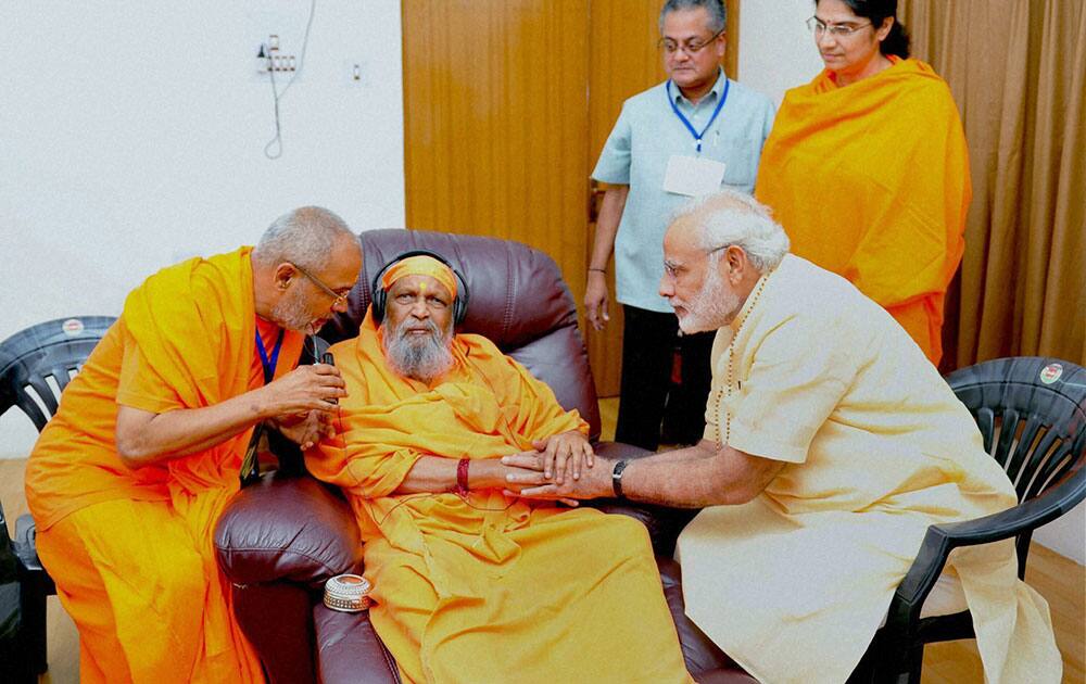 Prime Minister Narendra Modi meeting his guru Swami Dayanand Giri at his ashram in Sheeshamjhadi area of Rishikesh, Uttarakhand.