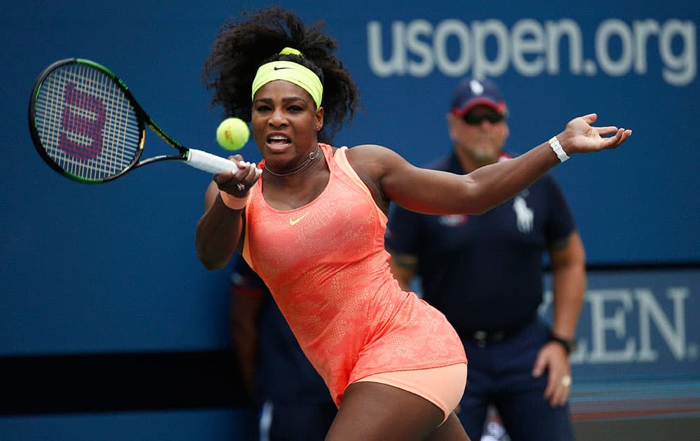 Serena Williams returns a shot to Roberta Vinci, of Italy, during a semifinal match at the US Open tennis tournament.