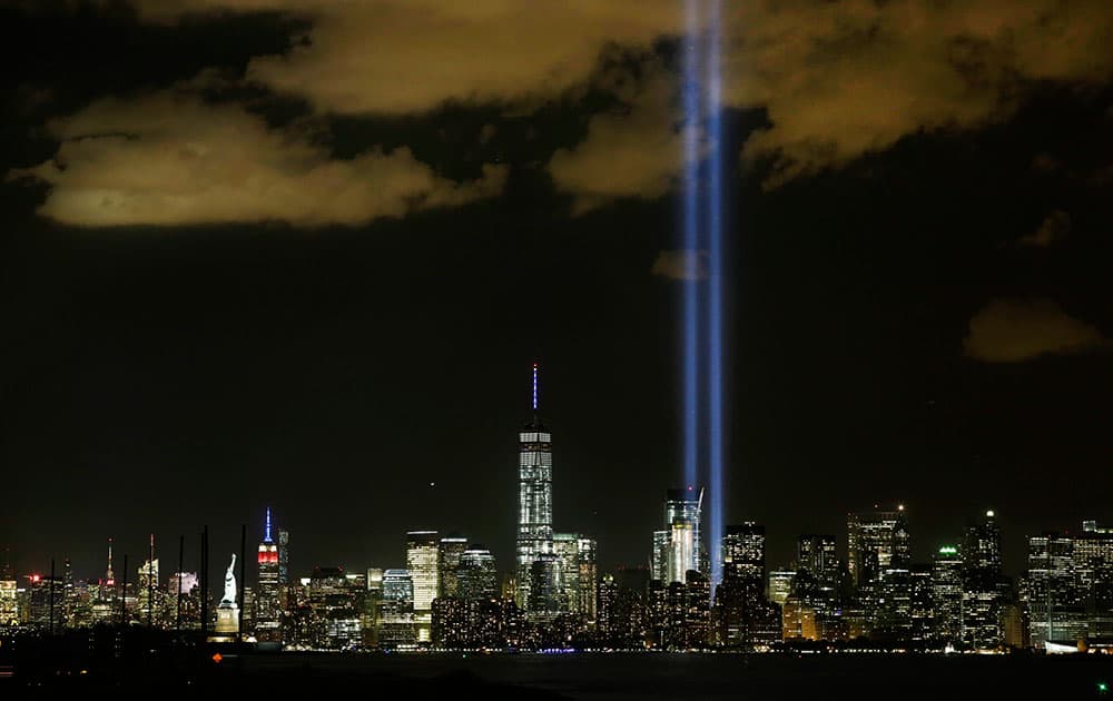 The Tribute in Light rises above the New York skyline and One World Trade Center, in a view from Bayonne, N.J. It was the 14th anniversary of the Sept. 11 terror attacks.