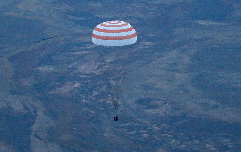 The Russian Soyuz TMA-16M capsule carrying a crew of Russia’s Gennady Padalka, Andreas Mogensen of the European Space Agency and Kazakhstan’s Aidyn Aimbetov prepares to land some 146 kilometers (90 miles) southeast of town of Dzhezkazgan, Kazakhstan.