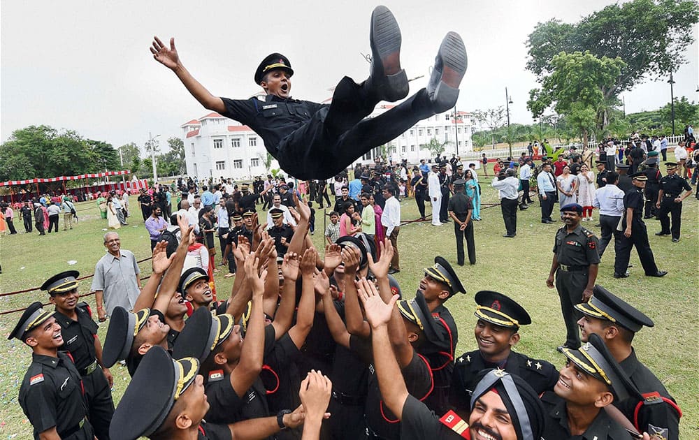 Cadets lift a colleague as they celebrate after a passing out parade at Officers Training Academy (OTA) in Chennai.
