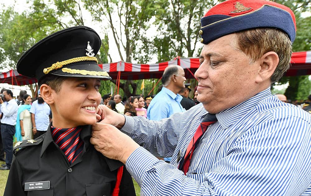 A cadet is being pipped as an officer by his family member at a passing out parade at Officers Training Academy (OTA) in Chennai.