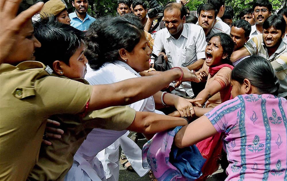 Police detain DSO activists during their agitation in front of Governor house in Kolkata to protest against State Governments education policy. 