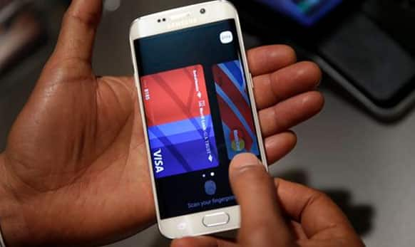 A Samsung employee demonstrates Samsung Pay using a Galaxy S6 Edge Plus in New York. 