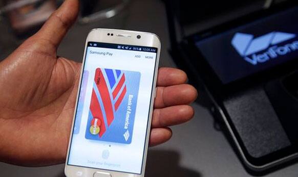 A Samsung employee demonstrates Samsung Pay using a Galaxy S6 Edge Plus in New York. 