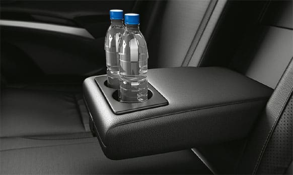 The car has retractable center armrest is incorporated with two cup holders.