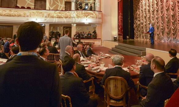 Russian President Vladimir Putin, right, speaks at a reception in honour of the participants in the BRICS and SCO Summits in Ufa, Russia.