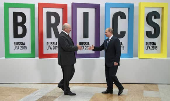 Russian President Vladimir Putin prepares to shake hands with Belarus' President Alexander Lukashenko.