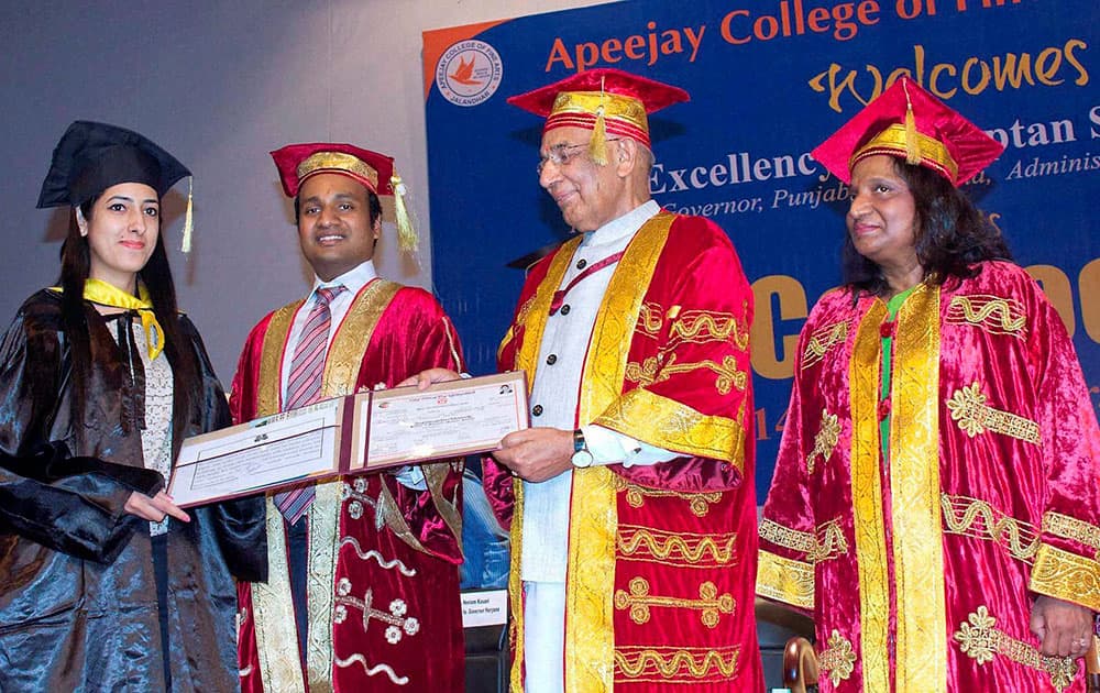 Punjab Governor Kaptan Singh Solanki presenting degree to a student during 36th annual convocation of Apeejay College of Fine Arts, in Jalandhar on Monday. Sushma Paul Berlia, Chancellor, Apeejay Stya University is also seen.