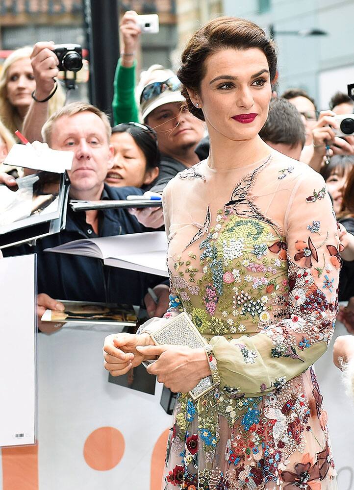 Actress Rachel Weisz poses for photographs on the red carpet during a premiere of 'Youth' on day 3 of the Toronto International Film Festival.